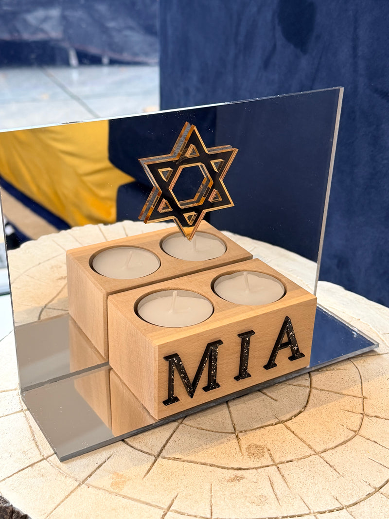 Wooden_faith_gift_with_MIA_branding_on_a_reflective_surface